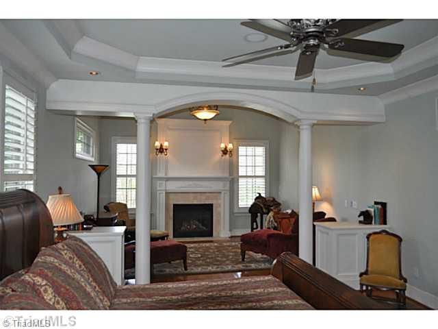 7045 Denison Road Summerfield, NC 27358 - Photo 10 of 16 Master Bedroom. The master suite s sitting room enjoys the second of the home s inviting fireplaces.