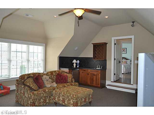 7045 Denison Road Summerfield, NC 27358 - Photo 11 of 16 Bonus. The large second floor bonus room enjoys a wet bar with a refrigerator.