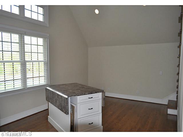 7045 Denison Road Summerfield, NC 27358 - Photo 13 of 16 Other. The large home office enjoys built-in cabinets, a desk, and this large worktable with drop leafs almost double the work surface.