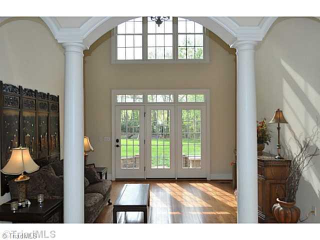 7045 Denison Road Summerfield, NC 27358 - Photo 3 of 16 Living Room. A gallery at the back of the foyer opens into a dramatic two story living room.