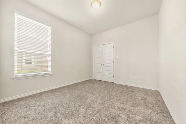 a view of a hallway view with staircase