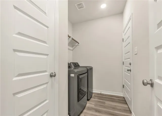 a front view of a house with a yard and porch