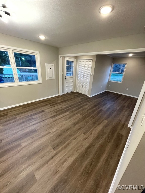 7617 Strath Road Henrico, VA 23231 - Photo 13 of 25 a view of an empty room with window and wooden floor