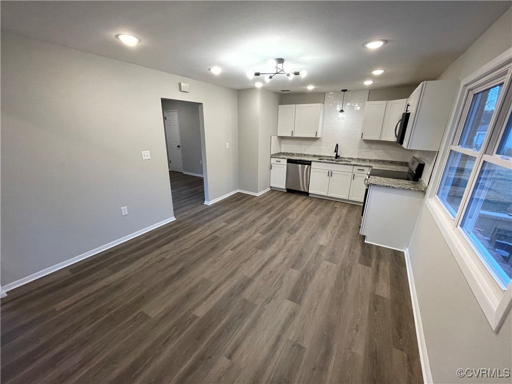 7617 Strath Road Henrico, VA 23231 - Photo 16 of 25 a view of a kitchen with wooden floor and electronic appliances