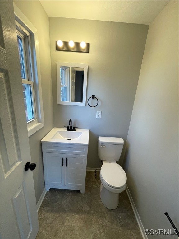 7617 Strath Road Henrico, VA 23231 - Photo 18 of 25 a bathroom with a sink and a mirror