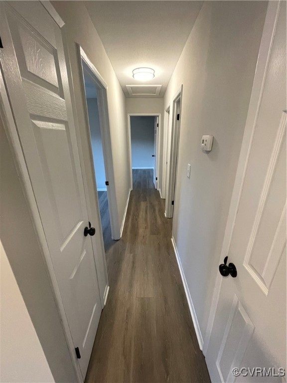 7617 Strath Road Henrico, VA 23231 - Photo 19 of 25 a view of a hallway with wooden floor and staircase