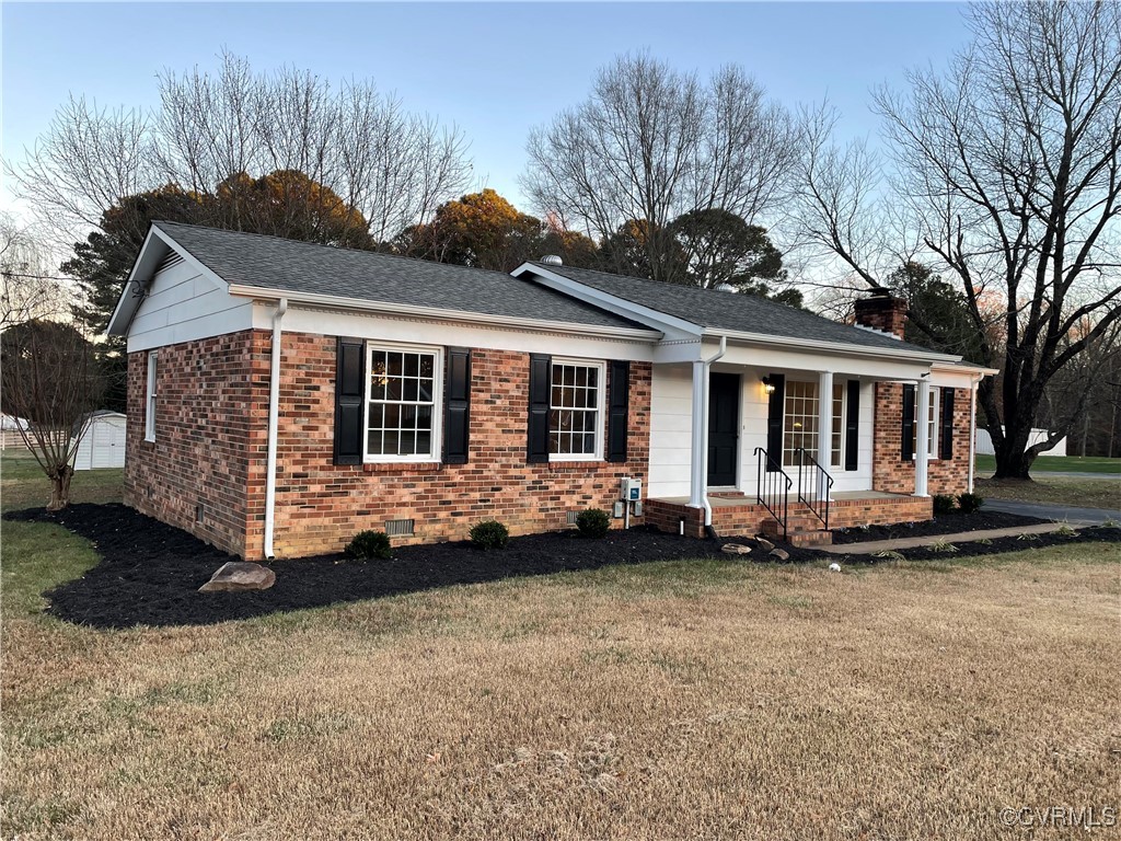 7617 Strath Road Henrico, VA 23231 - Photo 2 of 25 a front view of a house with a garden and plants