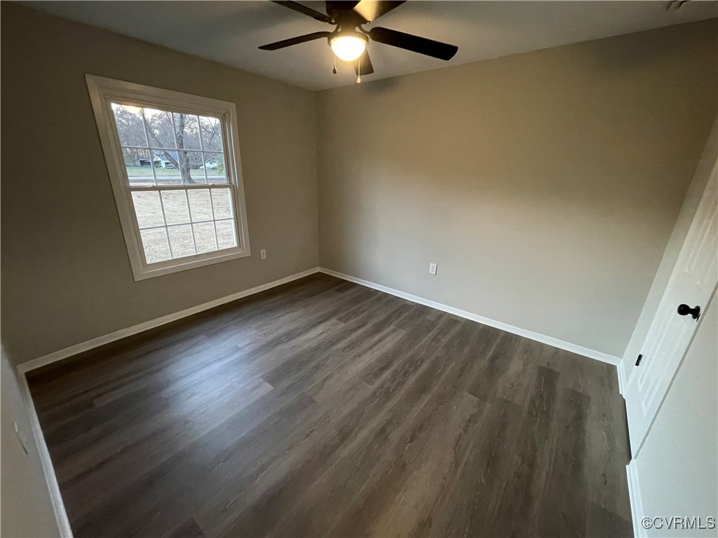 7617 Strath Road Henrico, VA 23231 - Photo 21 of 25 a view of an empty room with wooden floor and a window