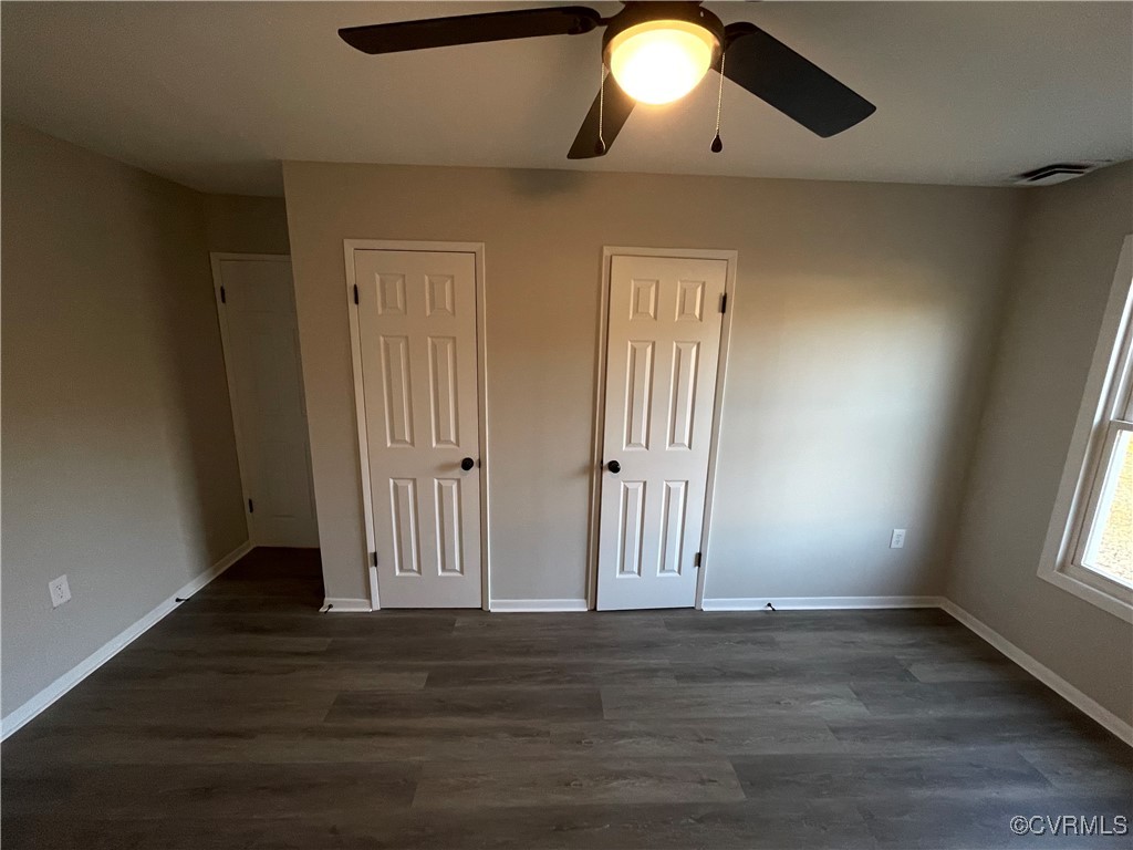 7617 Strath Road Henrico, VA 23231 - Photo 22 of 25 an empty room with wooden floor and windows