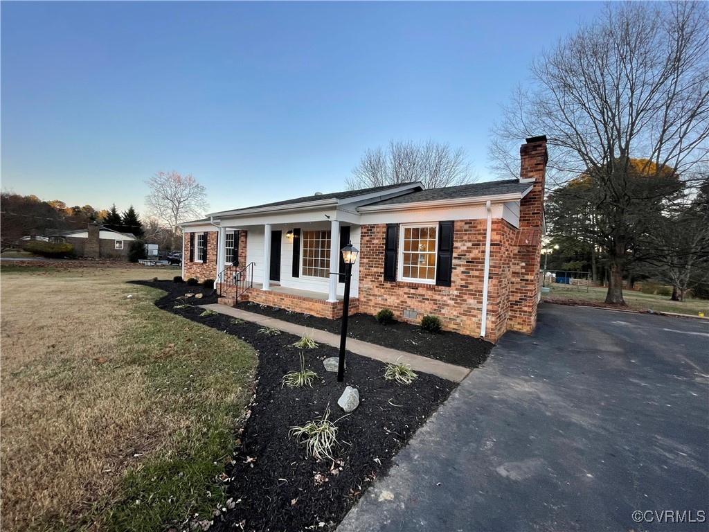 7617 Strath Road Henrico, VA 23231 - Photo 3 of 25 a view of a house with backyard and sitting area