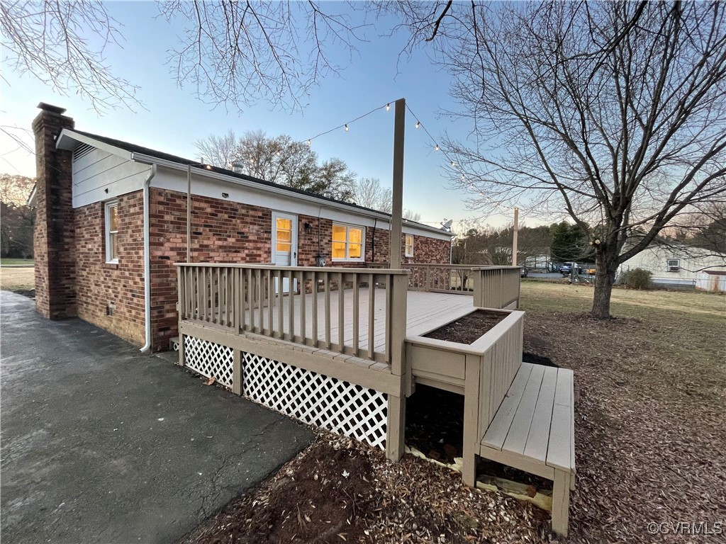 7617 Strath Road Henrico, VA 23231 - Photo 5 of 25 a view of a brick house with a large window