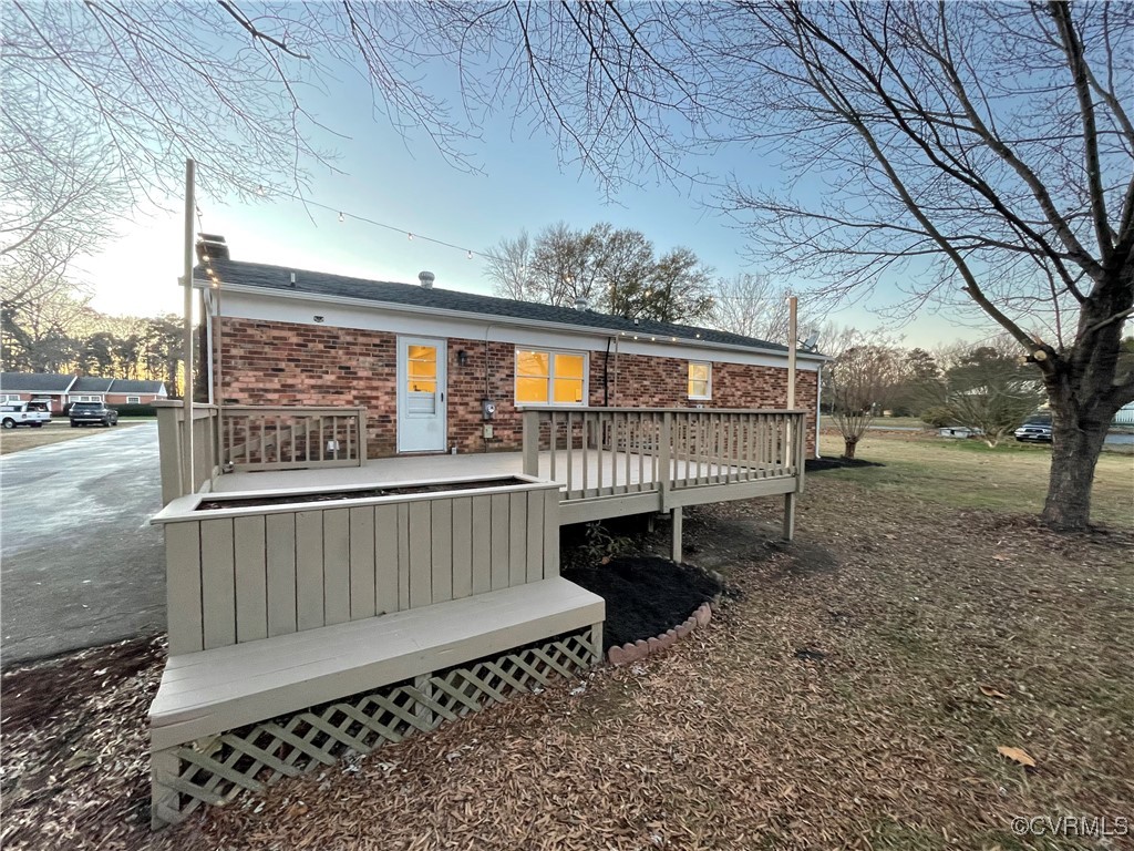 7617 Strath Road Henrico, VA 23231 - Photo 6 of 25 a view of a porch with furniture and a yard