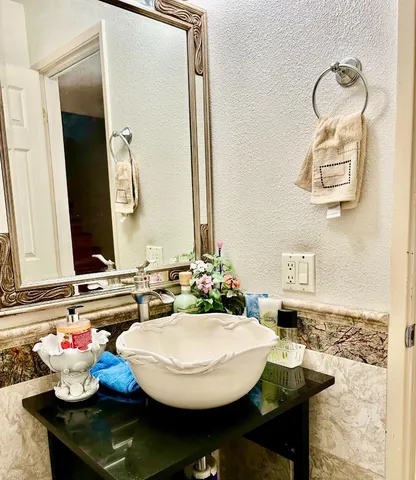 a dining room with a table and chairs