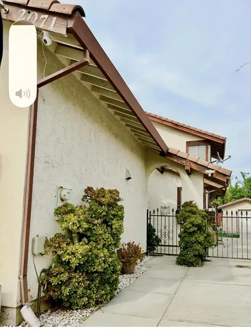 a house view with a garden space