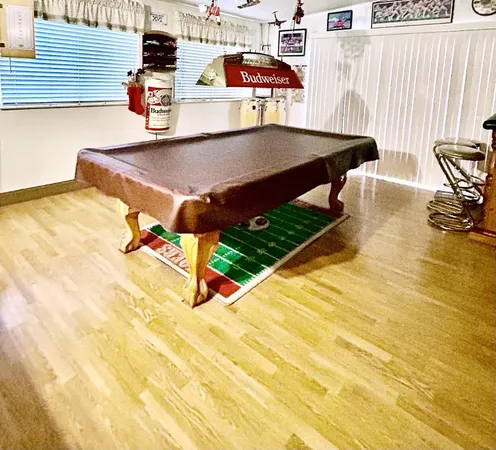 a view of a patio with a table and chairs