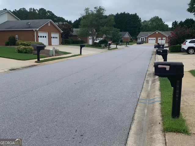 a house with yard and parking space