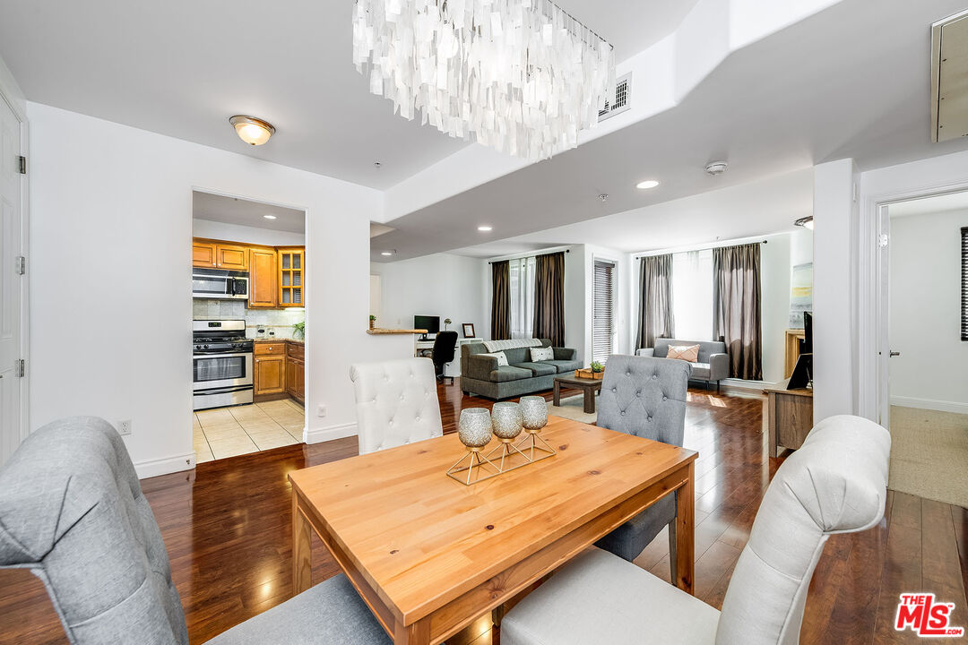 4724 Kester Avenue, Unit 209 Sherman Oaks, CA 91403 - Photo 11 of 27 a living room with furniture and a table