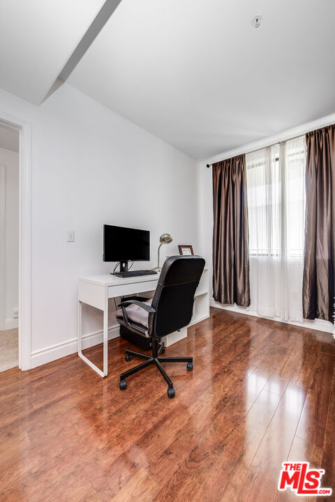 4724 Kester Avenue, Unit 209 Sherman Oaks, CA 91403 - Photo 17 of 27 a view of a workspace with furniture and a window
