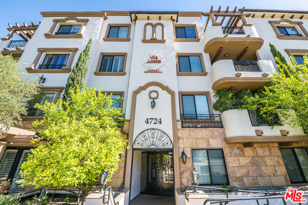 4724 Kester Avenue, Unit 209 Sherman Oaks, CA 91403 - Photo 7 of 27 a front view of a building with garden