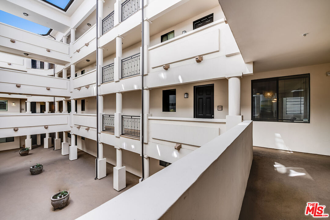 4724 Kester Avenue, Unit 209 Sherman Oaks, CA 91403 - Photo 8 of 27 a view of building with windows