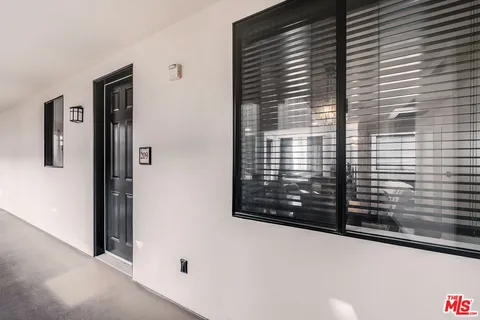 a view of a door and a window