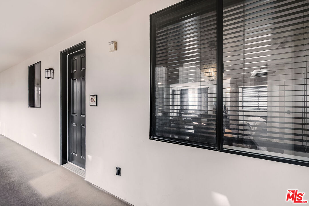 4724 Kester Avenue, Unit 209 Sherman Oaks, CA 91403 - Photo 9 of 27 a view of a door and a window
