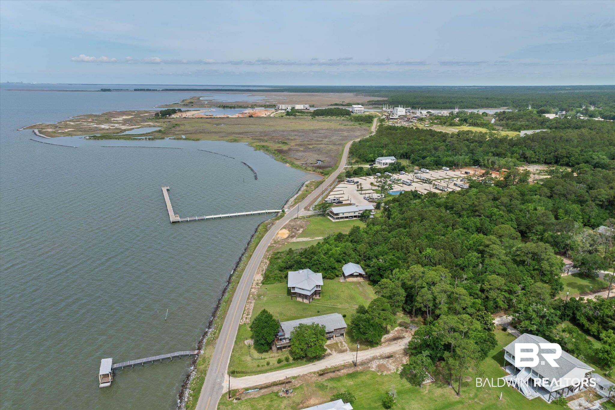 9100 Shell Belt Road Coden, AL 36523 - Photo 32 of 38 Expansive waterfront property featuring a private dock and a boat lift structure