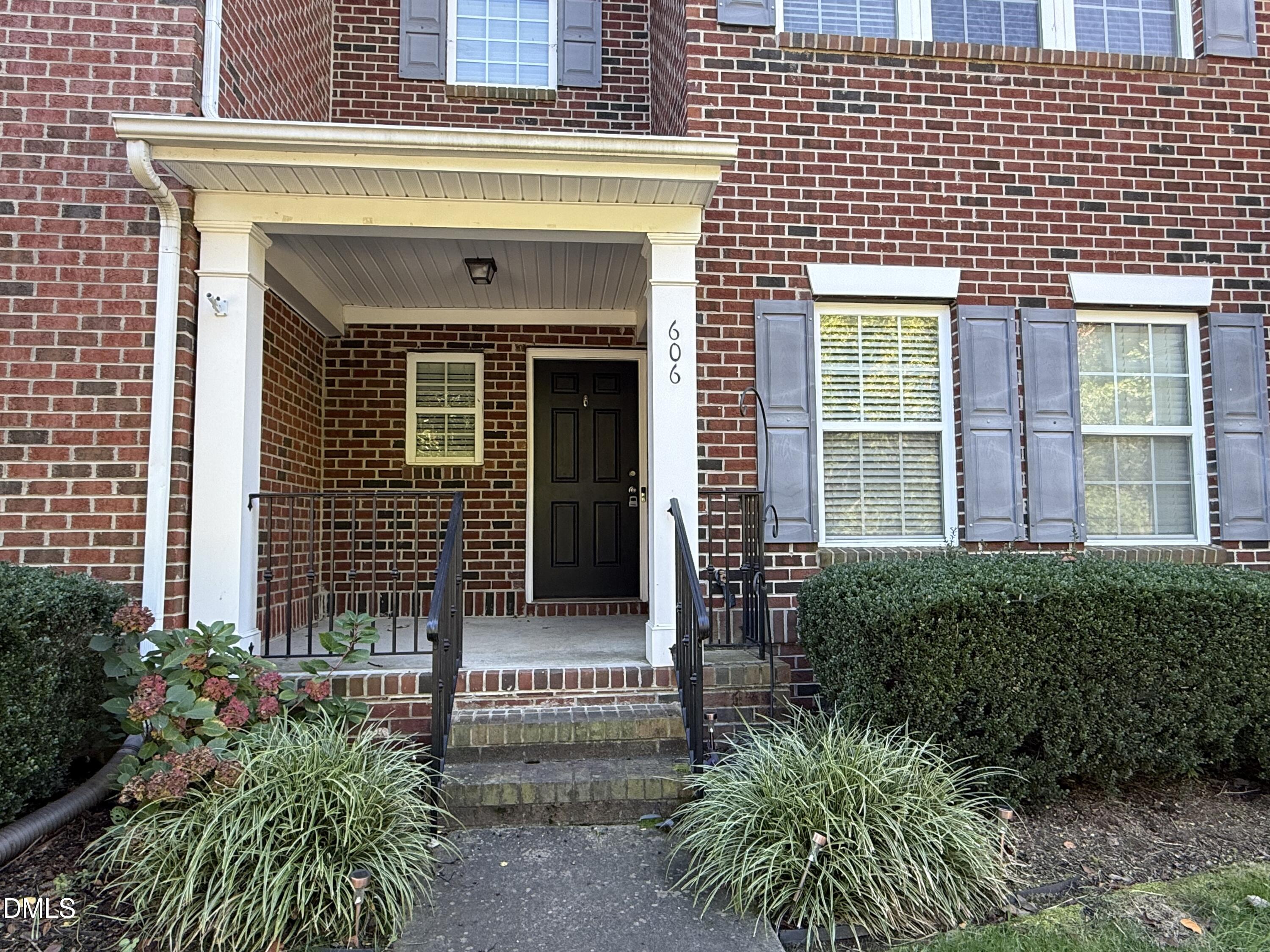 606 Sawcut Lane Apex, NC 27502 - Photo 1 of 30 a front view of a house with plants