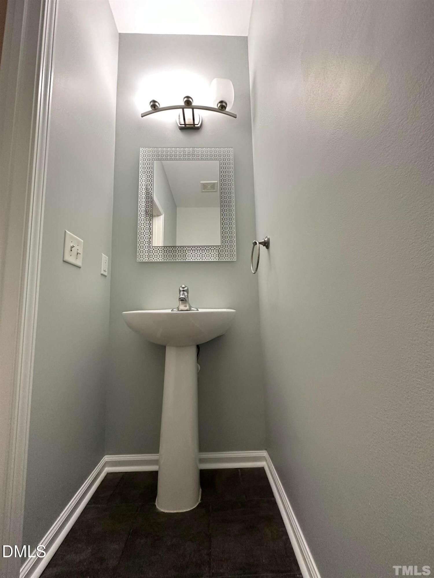 606 Sawcut Lane Apex, NC 27502 - Photo 15 of 30 a bathroom with a sink toilet and mirror