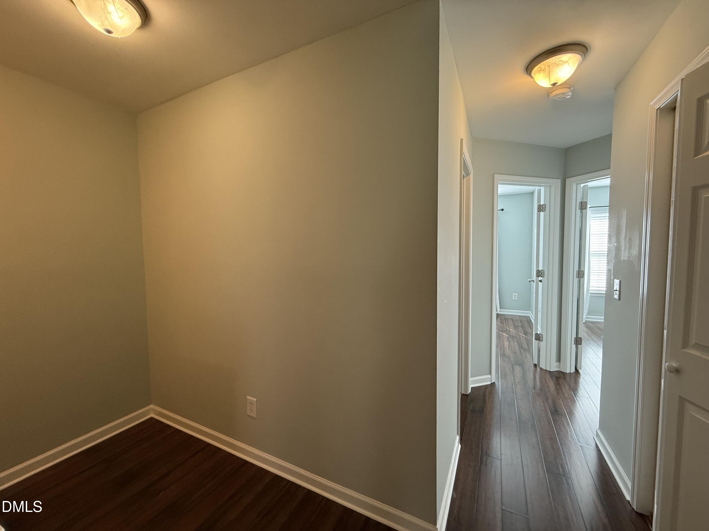 606 Sawcut Lane Apex, NC 27502 - Photo 16 of 30 a view of a hallway with wooden floor