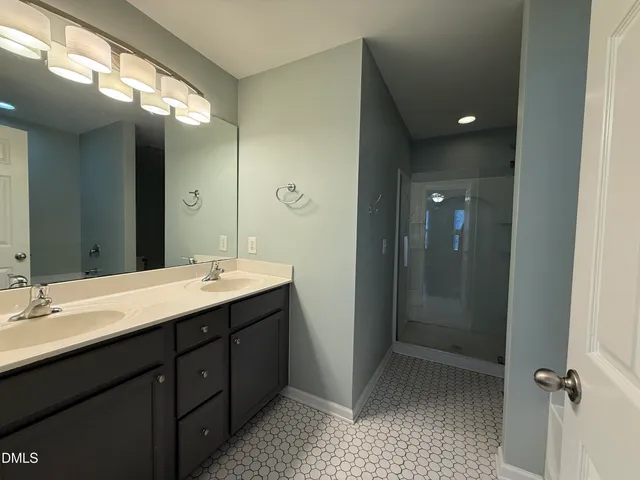 a bathroom with a tub and shower