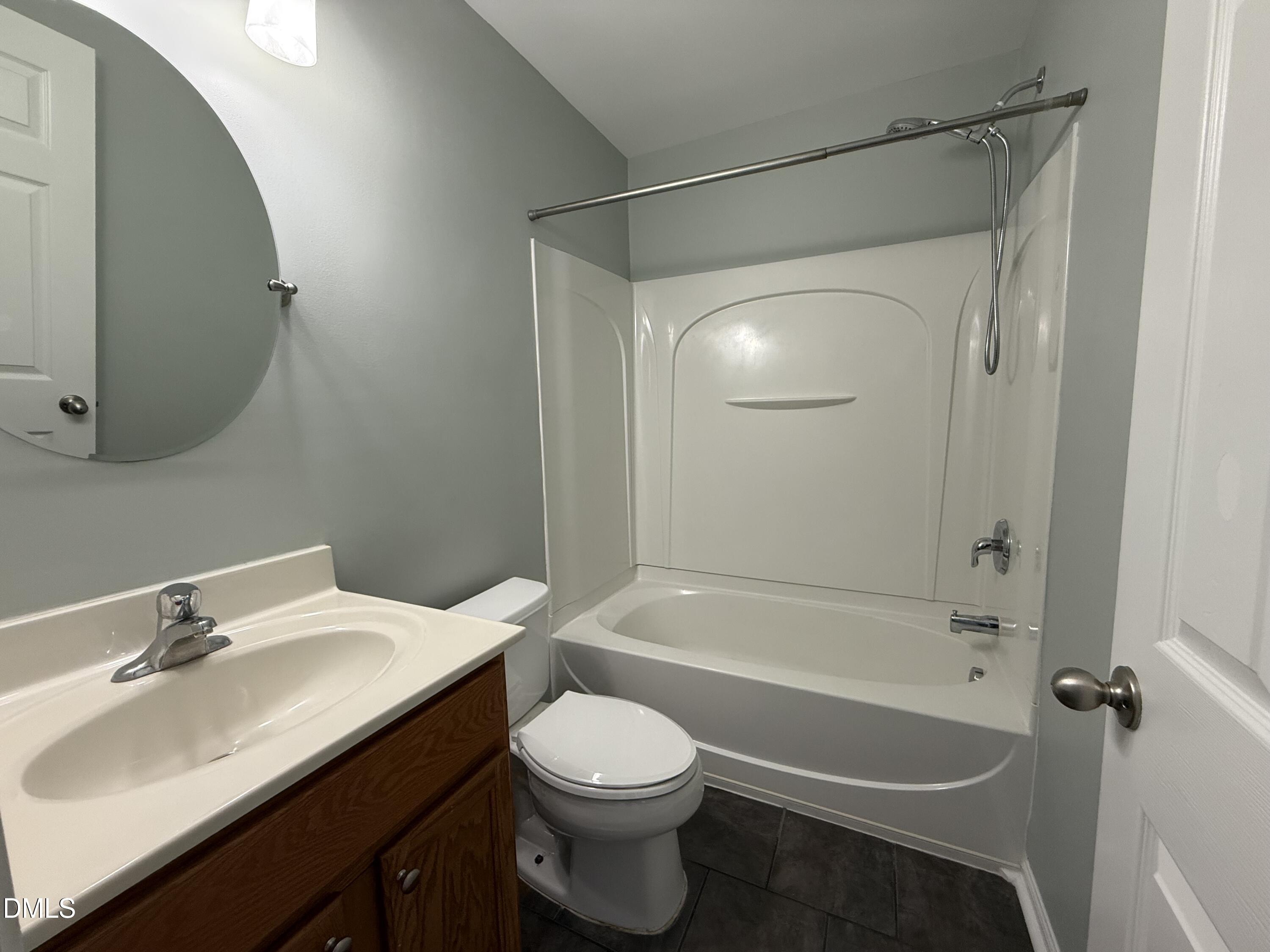 606 Sawcut Lane Apex, NC 27502 - Photo 23 of 30 a bathroom with a sink toilet and shower
