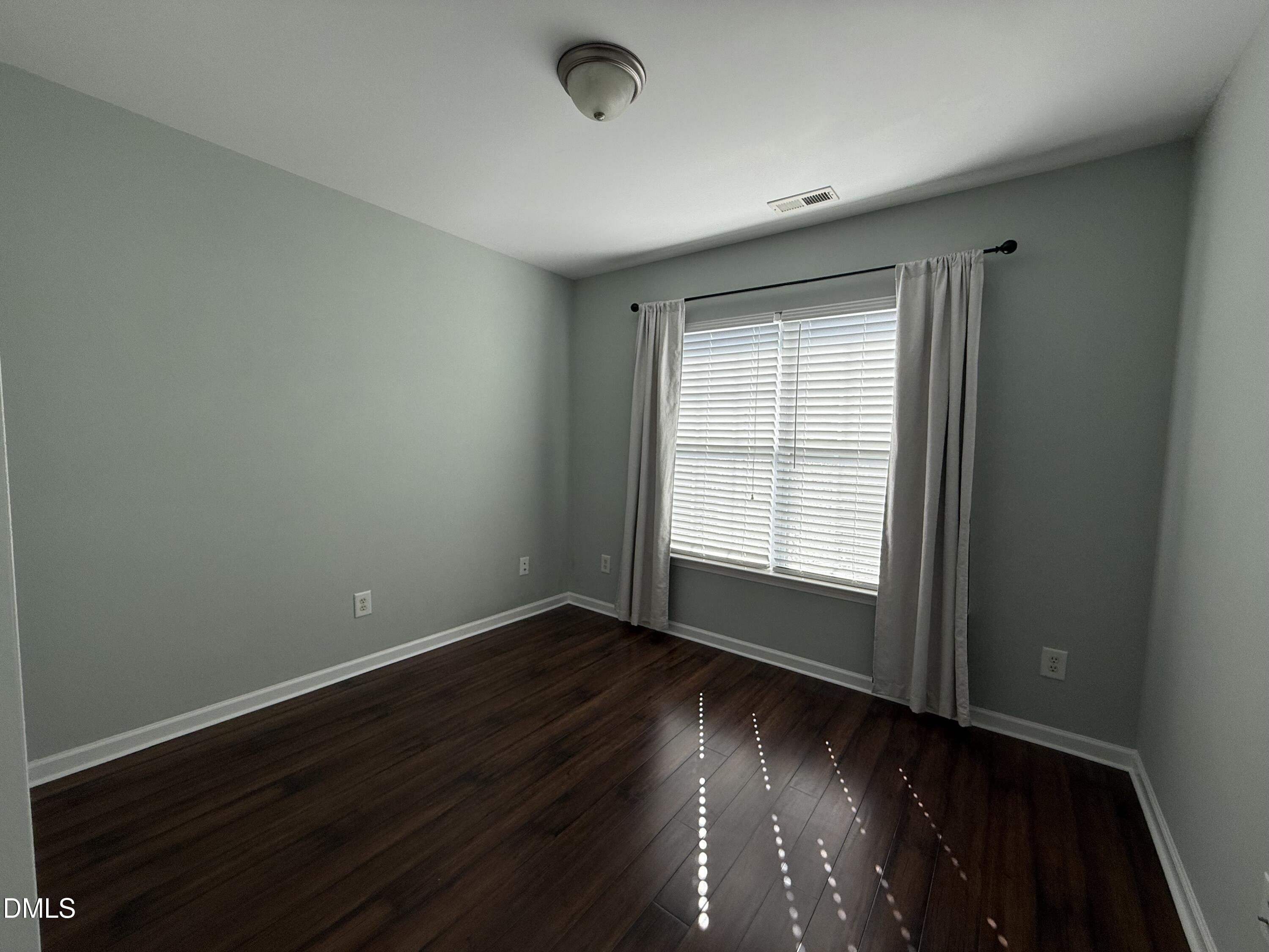 606 Sawcut Lane Apex, NC 27502 - Photo 24 of 30 wooden floor in an empty room with a window