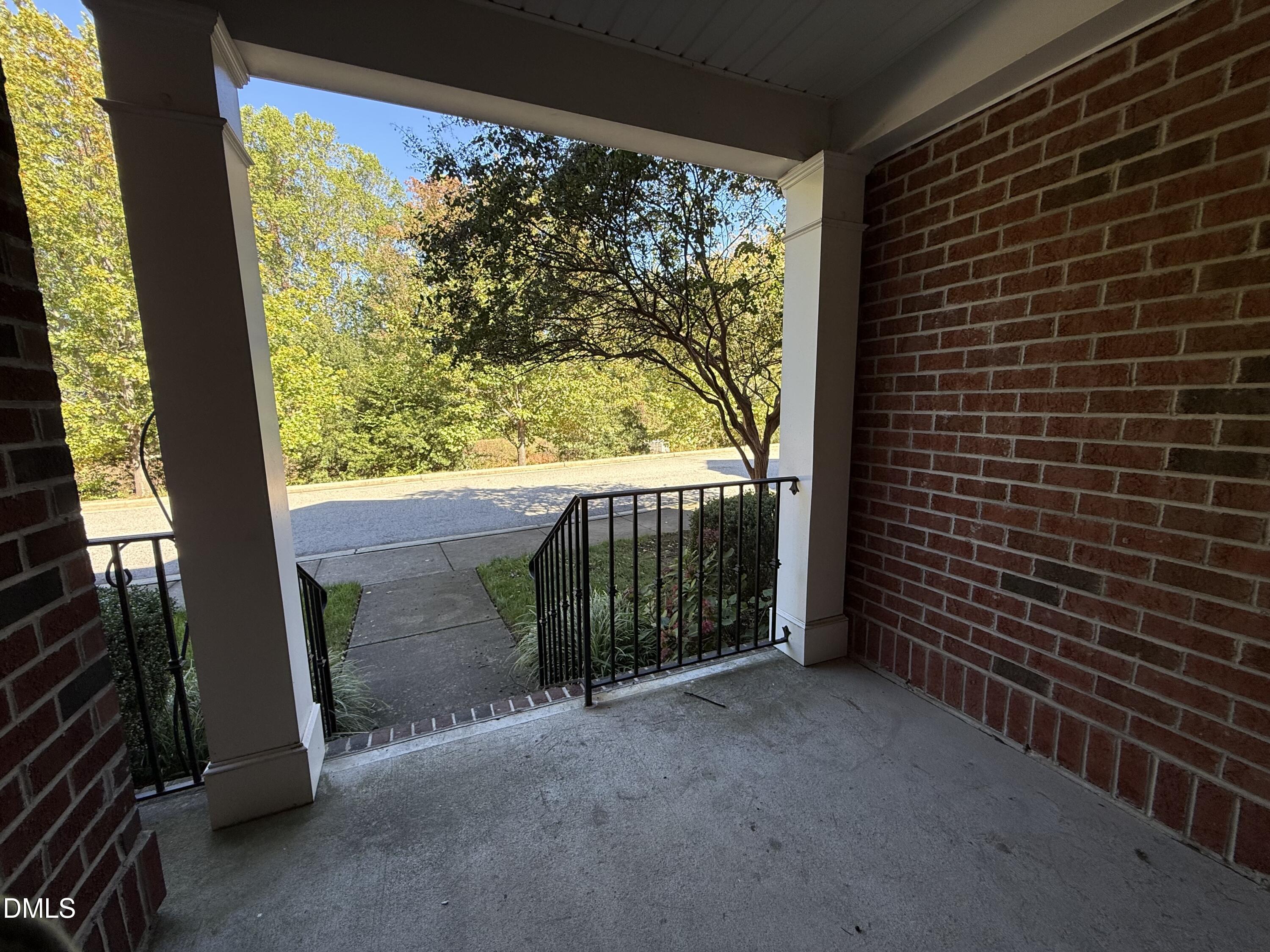 606 Sawcut Lane Apex, NC 27502 - Photo 25 of 30 a view of a porch with furniture and a yard