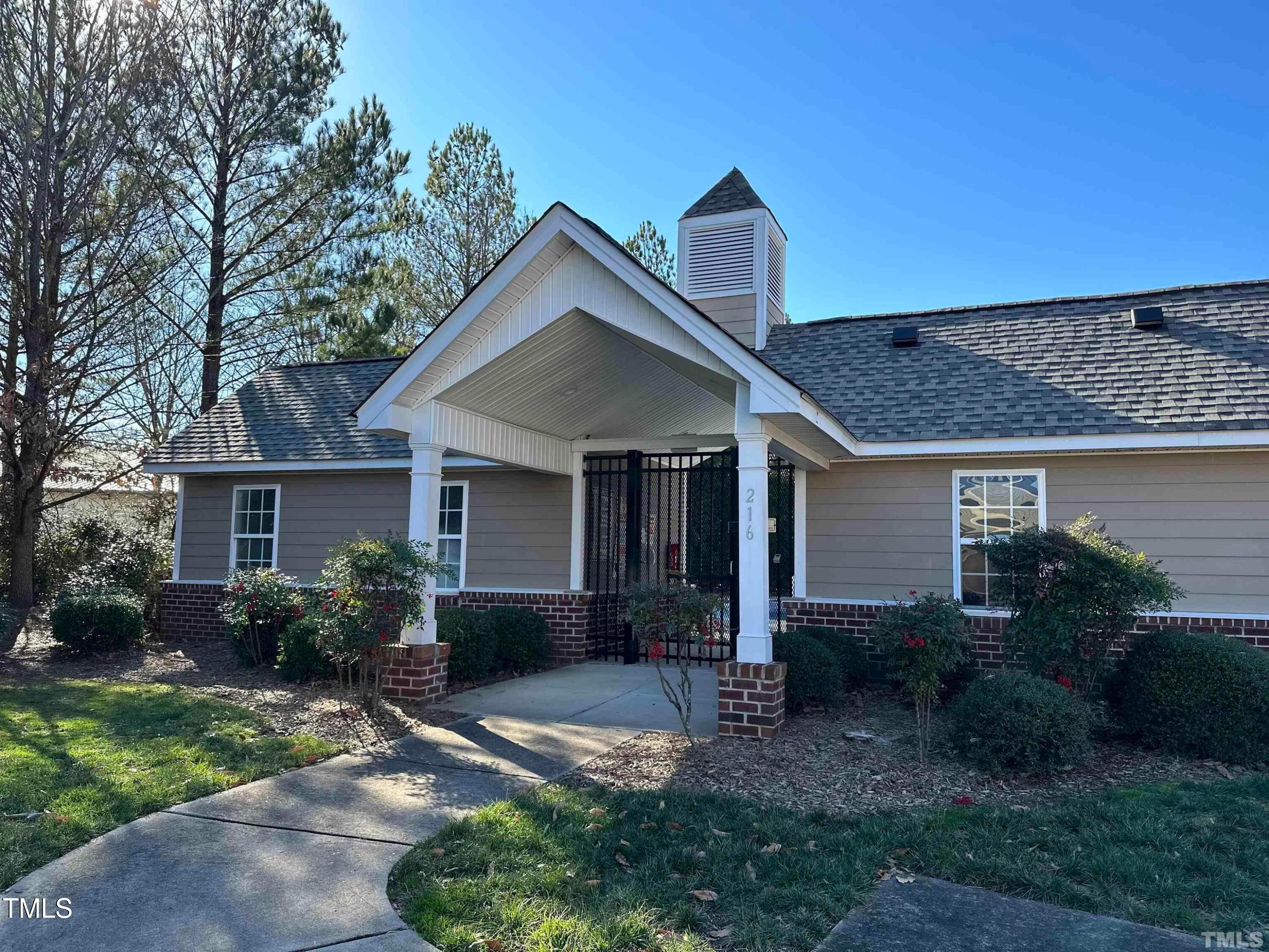 606 Sawcut Lane Apex, NC 27502 - Photo 29 of 30 a front view of a house with garden