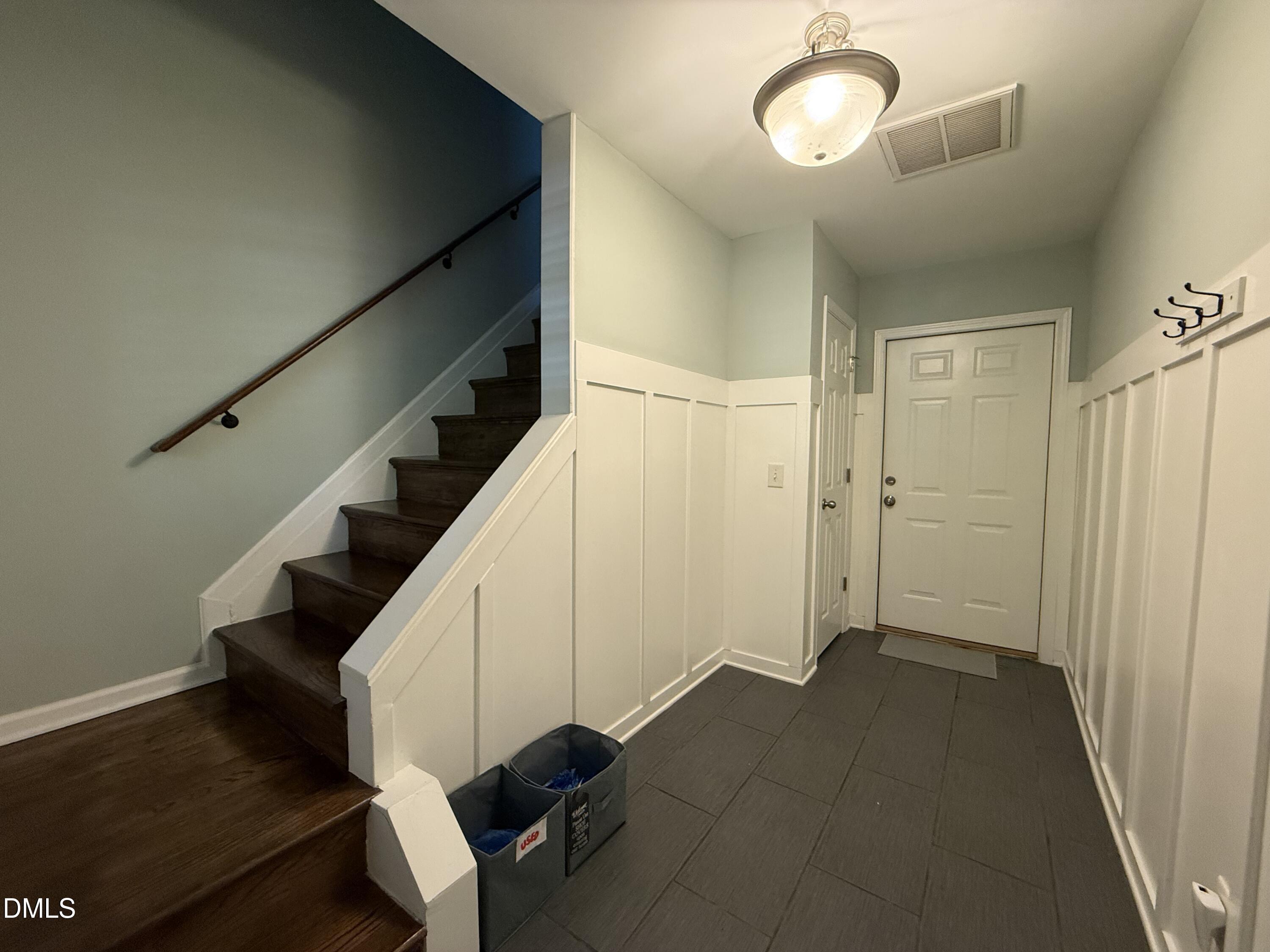 606 Sawcut Lane Apex, NC 27502 - Photo 3 of 30 a view of entryway and hall with wooden floor