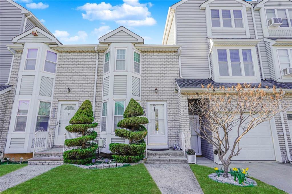 206 Rosedale Avenue Staten Island, NY 10312 - Photo 1 of 19 front view of a house with a garden