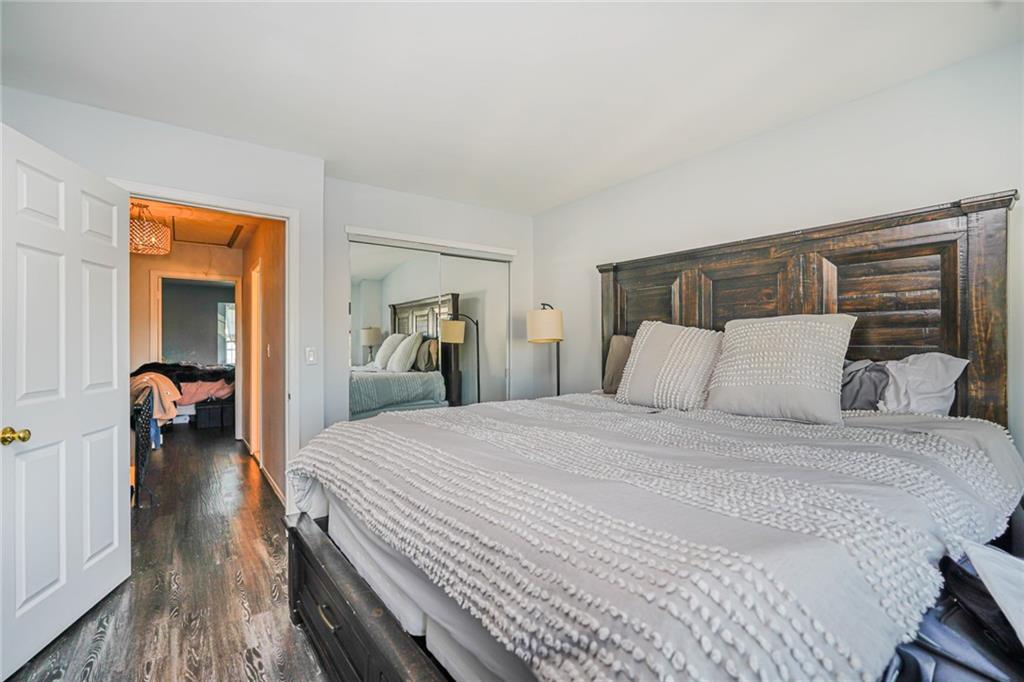 206 Rosedale Avenue Staten Island, NY 10312 - Photo 11 of 19 a bed room with a bed and a large mirror