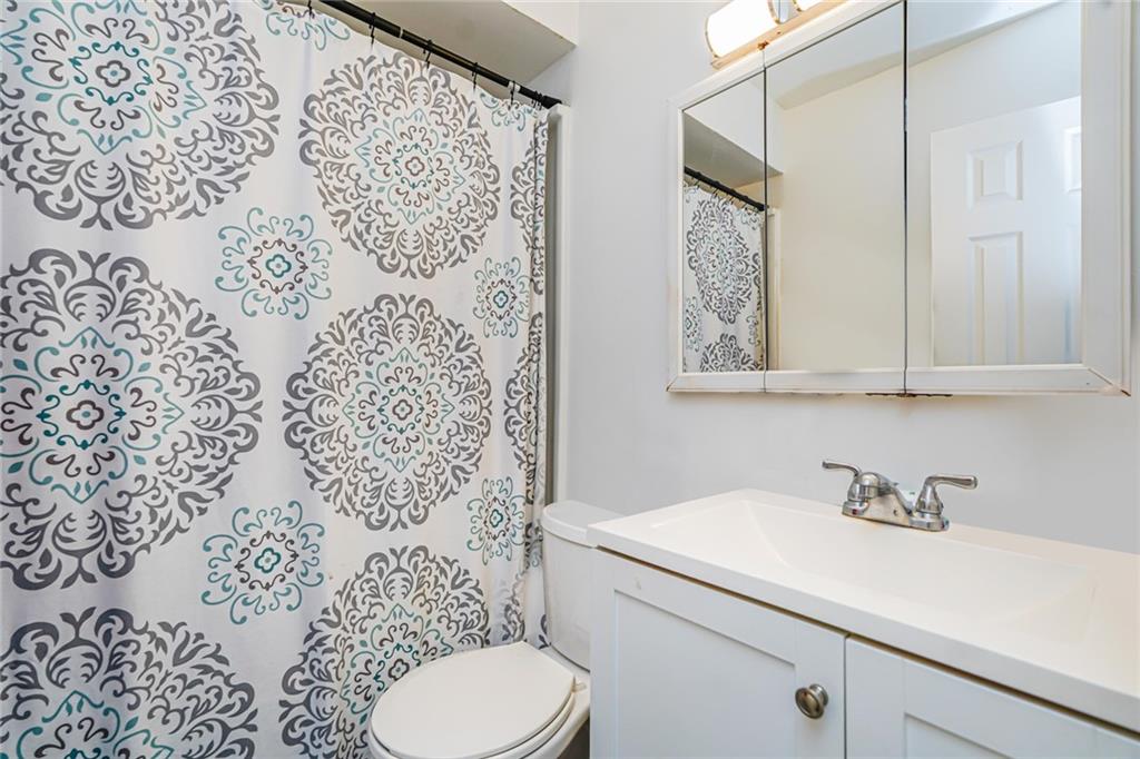 206 Rosedale Avenue Staten Island, NY 10312 - Photo 14 of 19 a bathroom with a sink toilet and shower