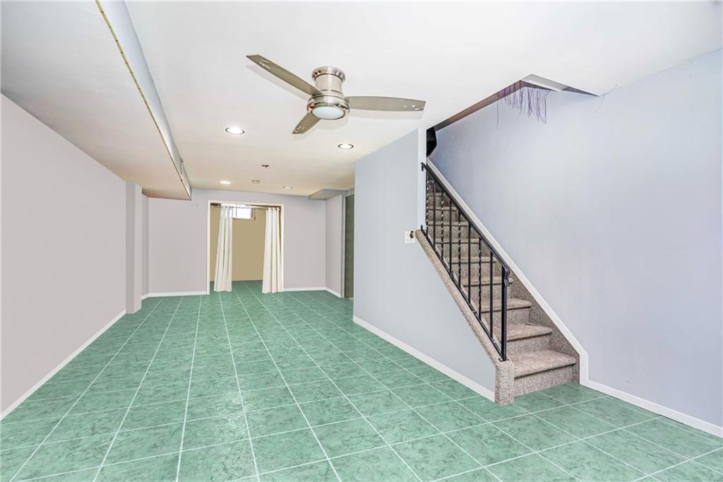 206 Rosedale Avenue Staten Island, NY 10312 - Photo 15 of 19 a view of a hallway with staircase and white walls