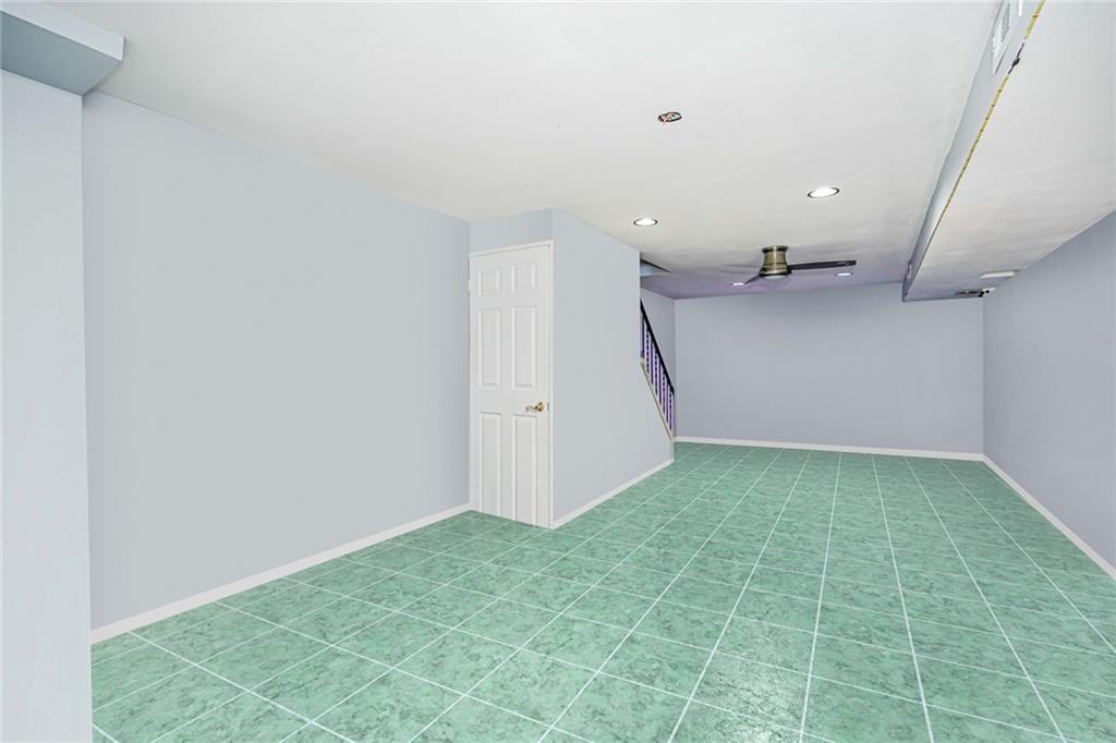 206 Rosedale Avenue Staten Island, NY 10312 - Photo 16 of 19 an empty room with a natural light