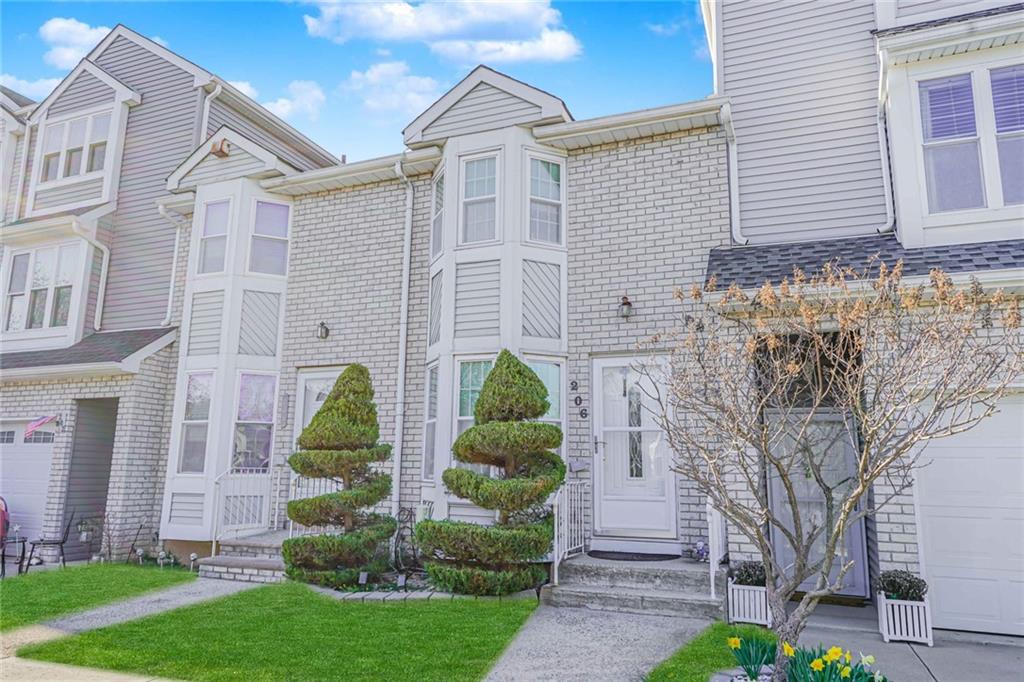 206 Rosedale Avenue Staten Island, NY 10312 - Photo 2 of 19 a front view of a house with garden