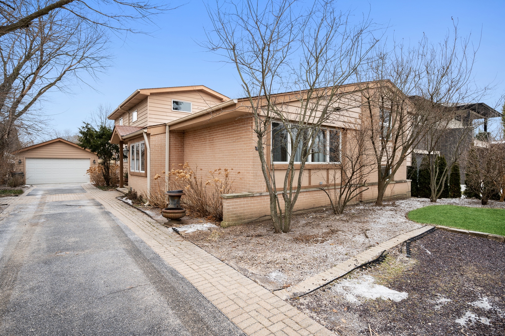 1111 Harms Road Glenview, IL 60025 - Photo 1 of 14 a front view of a house with a yard