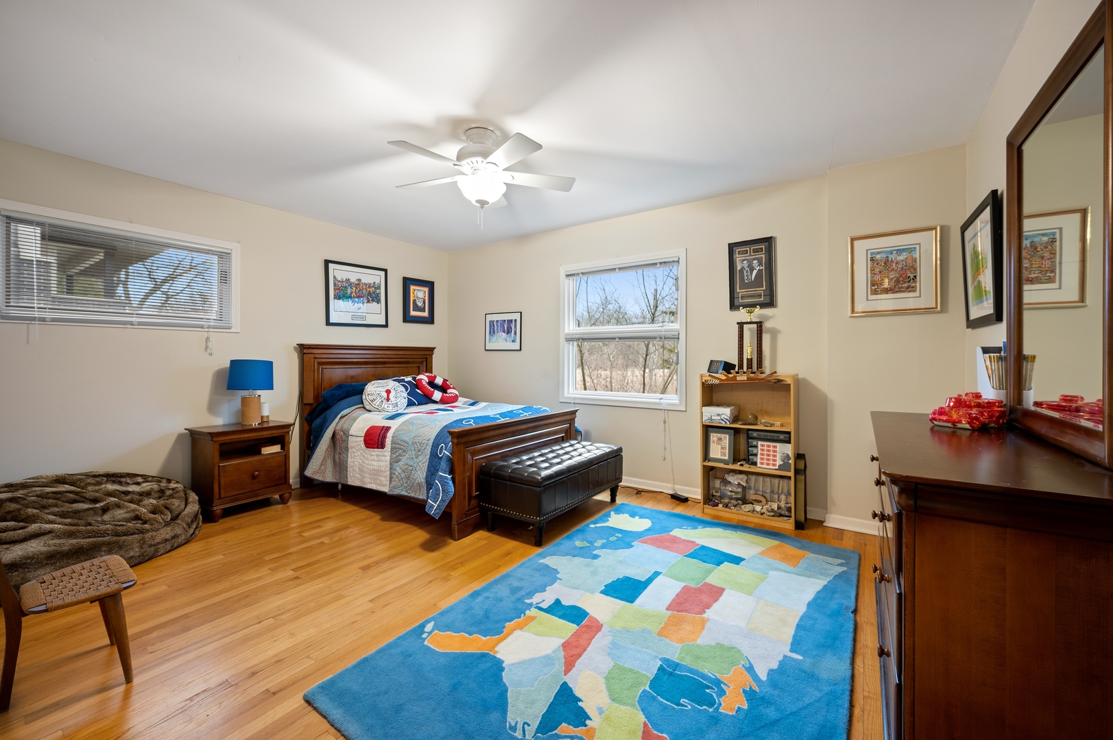 1111 Harms Road Glenview, IL 60025 - Photo 6 of 14 a bedroom with a bed and a bookshelf