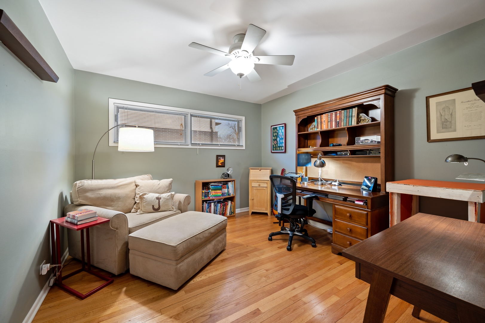 1111 Harms Road Glenview, IL 60025 - Photo 7 of 14 a living room with furniture and a flat screen tv