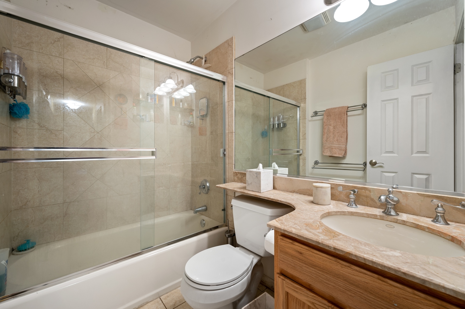 1111 Harms Road Glenview, IL 60025 - Photo 8 of 14 a bathroom with a granite countertop sink toilet and shower