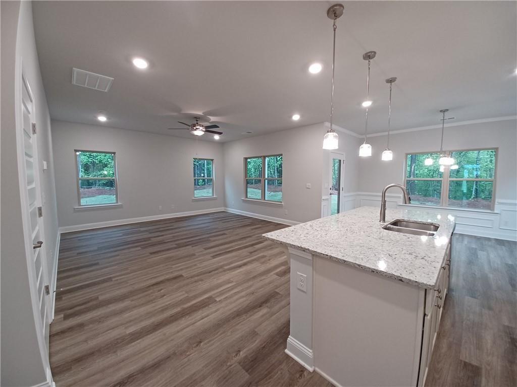 534 Creek Road Cornelia, GA 30531 - Photo 10 of 11 a kitchen with kitchen island a sink stainless steel appliances and window