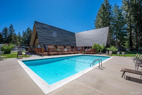 a view of swimming pool with a yard
