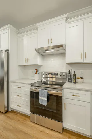 a bedroom with a bed and a ceiling fan
