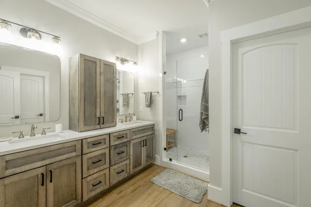 a bathroom with a shower and a sink